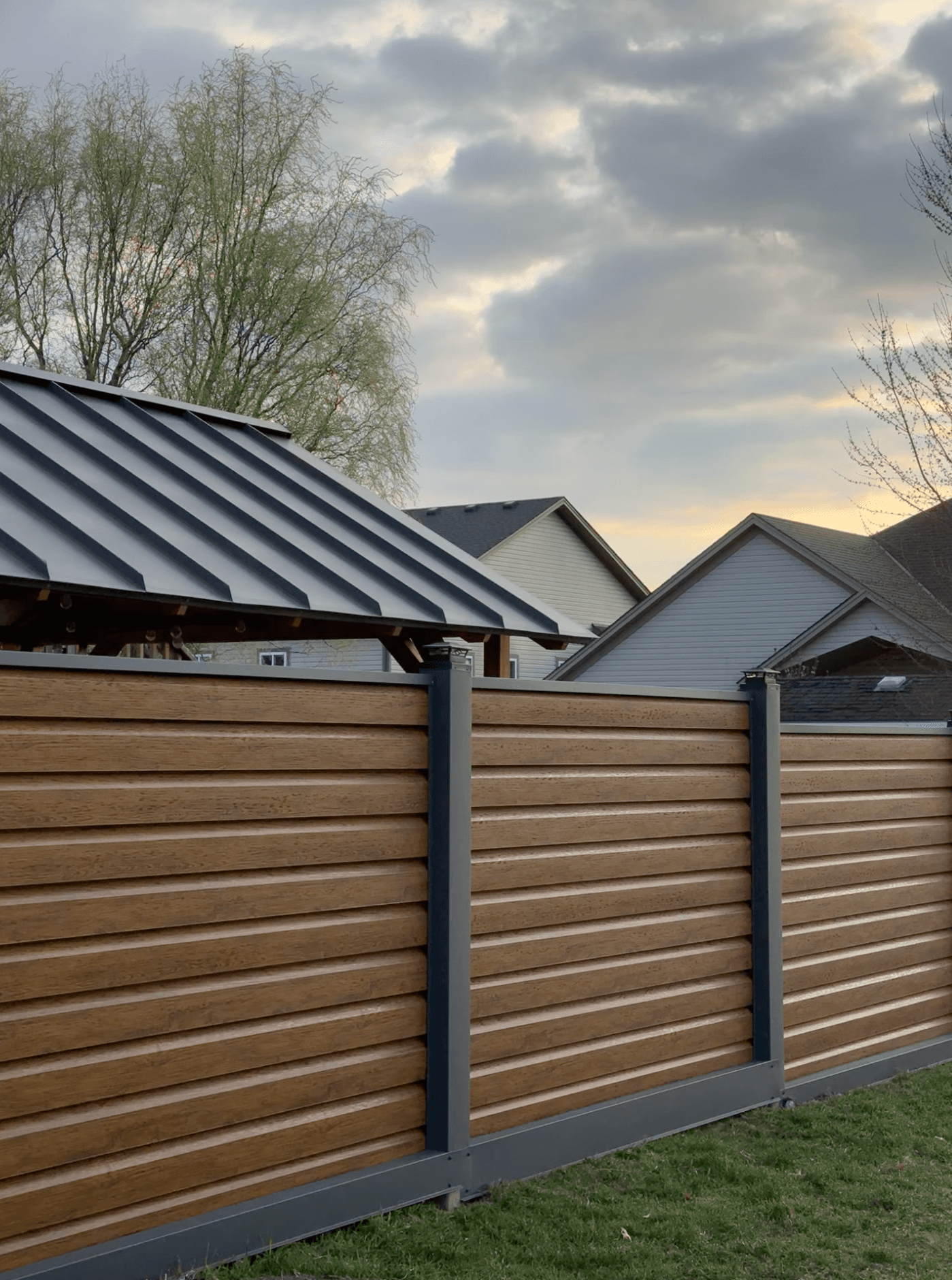 Custom horizontal metal fence with powder-coated steel posts